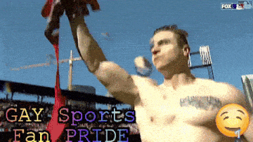 a shirtless man holds up a red ribbon with the words gay sports fan pride written below him