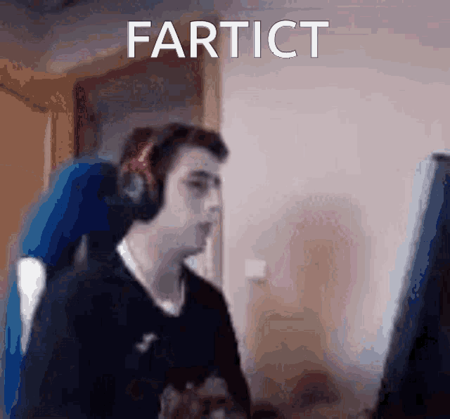 a man wearing headphones is sitting in front of a computer screen with the word fartict written on the bottom