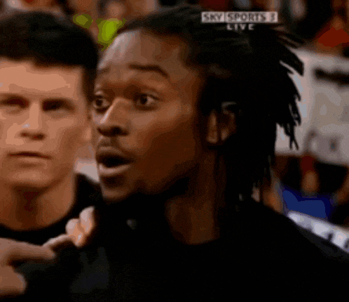 a man with dreadlocks is watching a basketball game on sky sports live