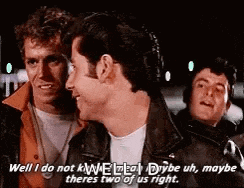 a group of men are standing next to each other and one of them is talking to another man .