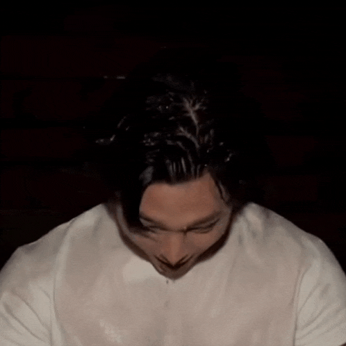 a close up of a man 's face with water coming out of his nose