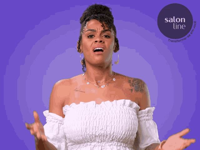 a woman in a white off the shoulder top stands in front of a purple background with a salon line logo