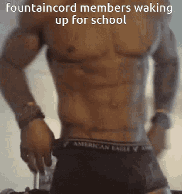 a shirtless man wearing american eagle underwear is waking up