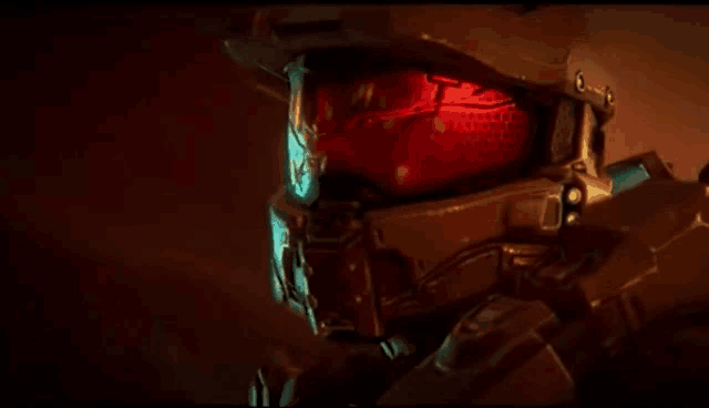 a close up of a video game character 's helmet with red lights coming out of it .