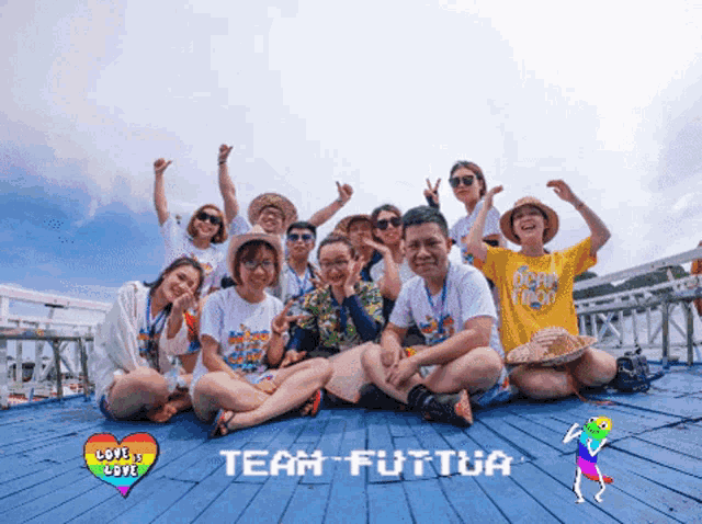 a group of people posing for a picture with the words team futtua on the bottom left