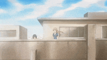 a man and a woman are standing on the roof of a building with a blue sky in the background