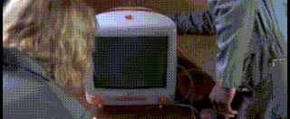 a white apple computer with an apple logo on the top