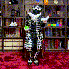 a person in a clown costume is standing in front of a bookcase