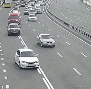 a car is hanging over the side of the road