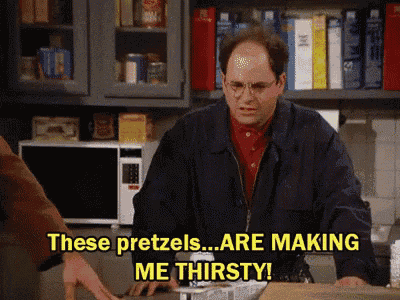 a man is making pretzels in a kitchen and says these pretzels are making me thirsty