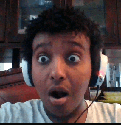 a man wearing headphones is making a funny face