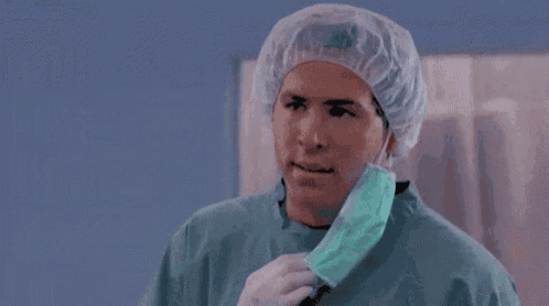 a surgeon wearing a surgical cap and mask is asking but why ?