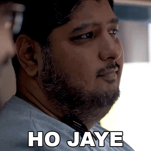 a man with a beard says ho jaye in black letters