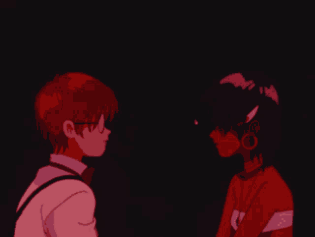 a boy and a girl are looking at each other and the girl is wearing a shirt that says sai