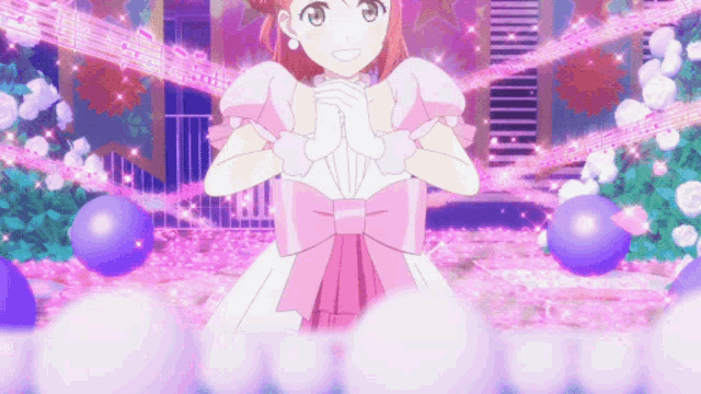 a girl in a pink dress with a bow is standing in front of a purple background with music notes .
