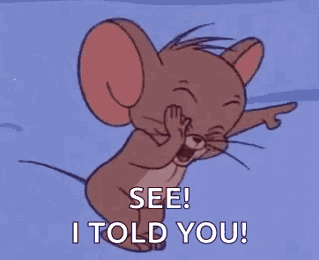 jerry from tom and jerry is laughing and pointing at something .