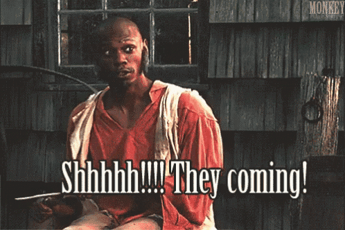 a man in a red shirt is saying they coming