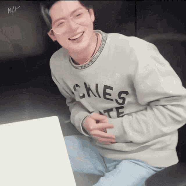 a man wearing a sweater that says skies on it