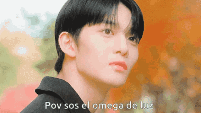 a close up of a person 's face with the words pov sos el omega de luz written below it