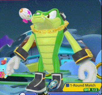 a green cartoon character is holding a balloon in his mouth .