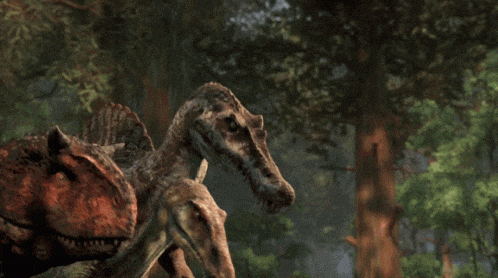 a group of dinosaurs with their mouths open