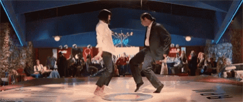 a man and a woman are dancing on a dance floor in a club .
