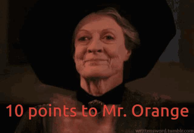 a woman in a black hat applauds with the words 10 points to mr. orange