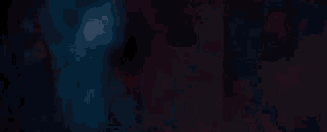 a close up of a red light beam on a dark background .