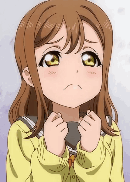 a girl with brown hair and yellow eyes is wearing a yellow sweater