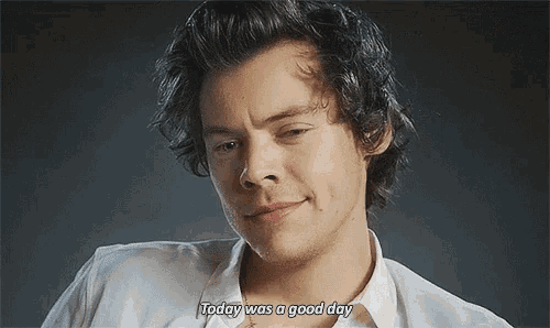 harry styles is wearing a white shirt and smiling while saying today was a good day .
