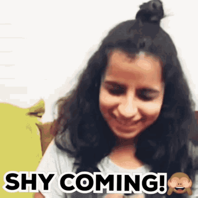 a woman is smiling with the words shy coming in the background