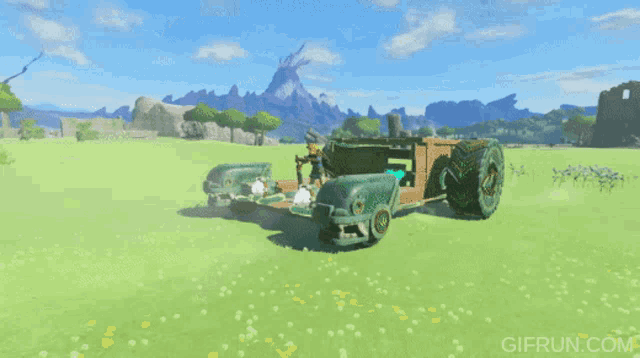 a gif from gifrun.com shows a green car in a field