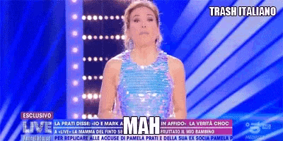 a woman in a sequined dress stands in front of a screen that says mah