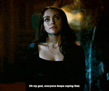 a woman in a black dress says oh my god everyone keeps saying that .