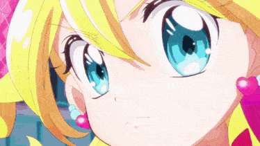 a close up of a cartoon girl with blue eyes