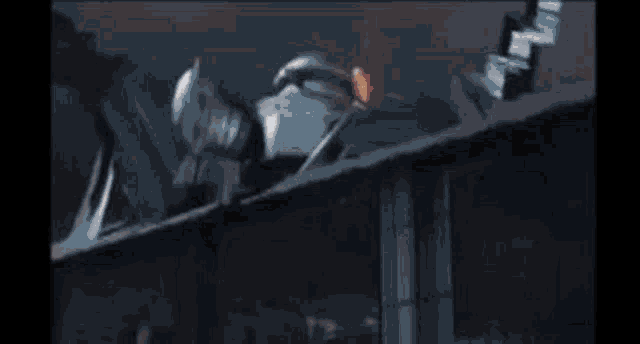 a giant spider is crawling on the roof of a building in a video game .