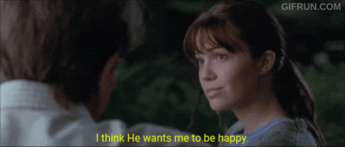 a man and a woman are looking at each other and the woman is saying i think he wants me to be happy