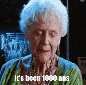 an elderly woman says it 's been 1000 ans in a green shirt