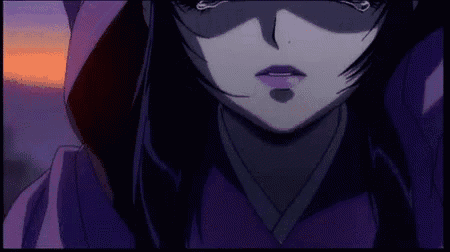 a close up of a girl 's face with purple hair