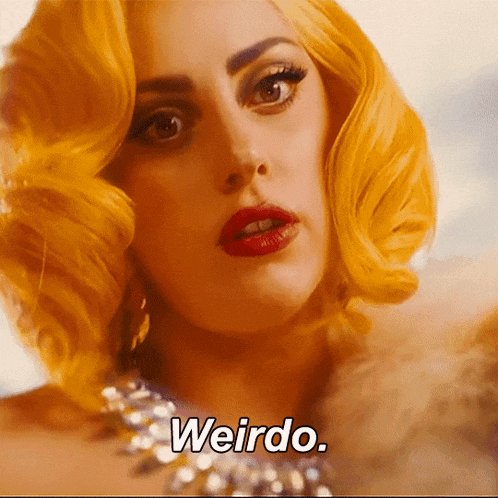 a close up of a woman 's face with the words weirdo written below her