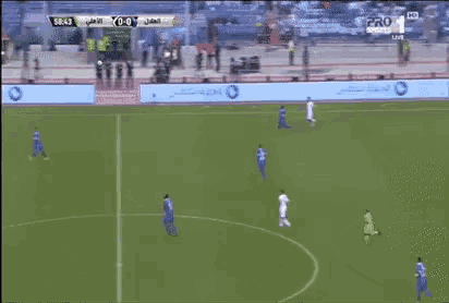 a soccer game is being played on a field with a stc banner in the background