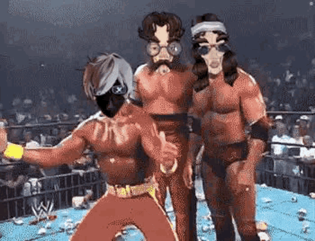 three wrestlers are standing in a wrestling ring .