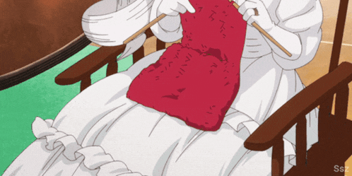 a woman in a white dress is knitting a red item