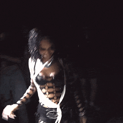 a woman in a very revealing outfit is dancing
