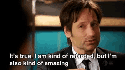 a man in a suit and tie is saying it 's true i am kind of retarded but i m also kind of amazing