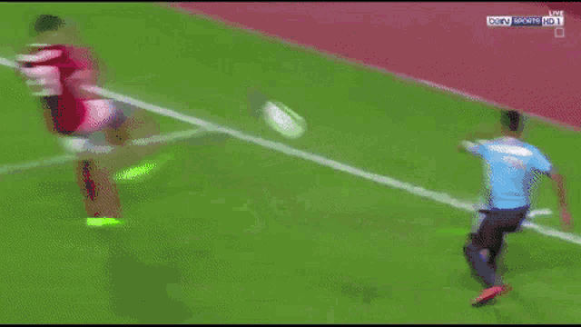 a soccer goalie is trying to stop a ball from going into the net