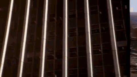 a tall building with a lot of windows and a lot of lights on it