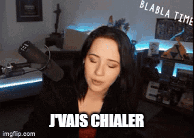 a woman sitting in front of a microphone with the words j'vais chialer on her face