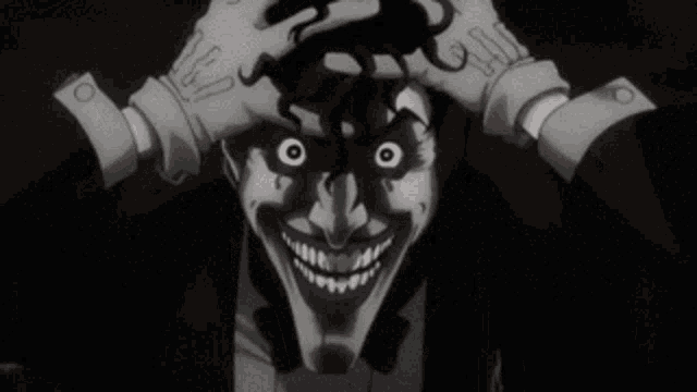 a close up of the joker 's face with blood on it .