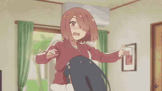 a girl with pink hair is standing in a room holding a phone